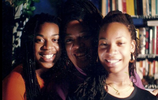 The author, her mom and sister celebrating Kwanzaa in 1995 (courtesy of Moji Alawode-El)